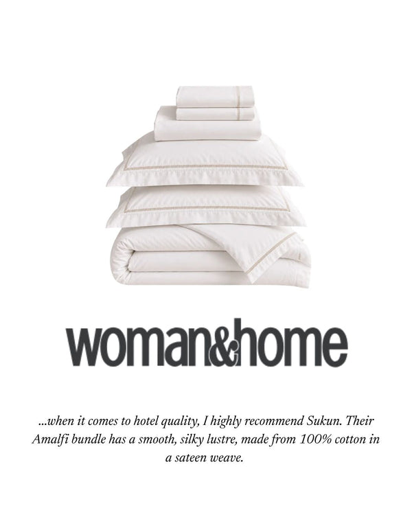 Sukun Amalfi Bundle Set in crisp white cotton sateen on a hotel-style made bed, as featured in Woman & Home