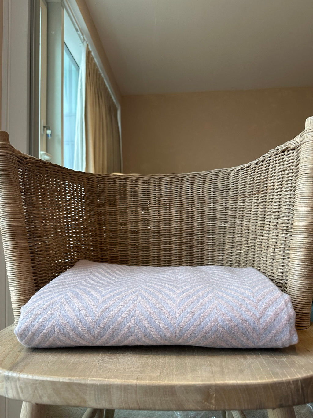 comfy thorw folded on a chair in chevron design