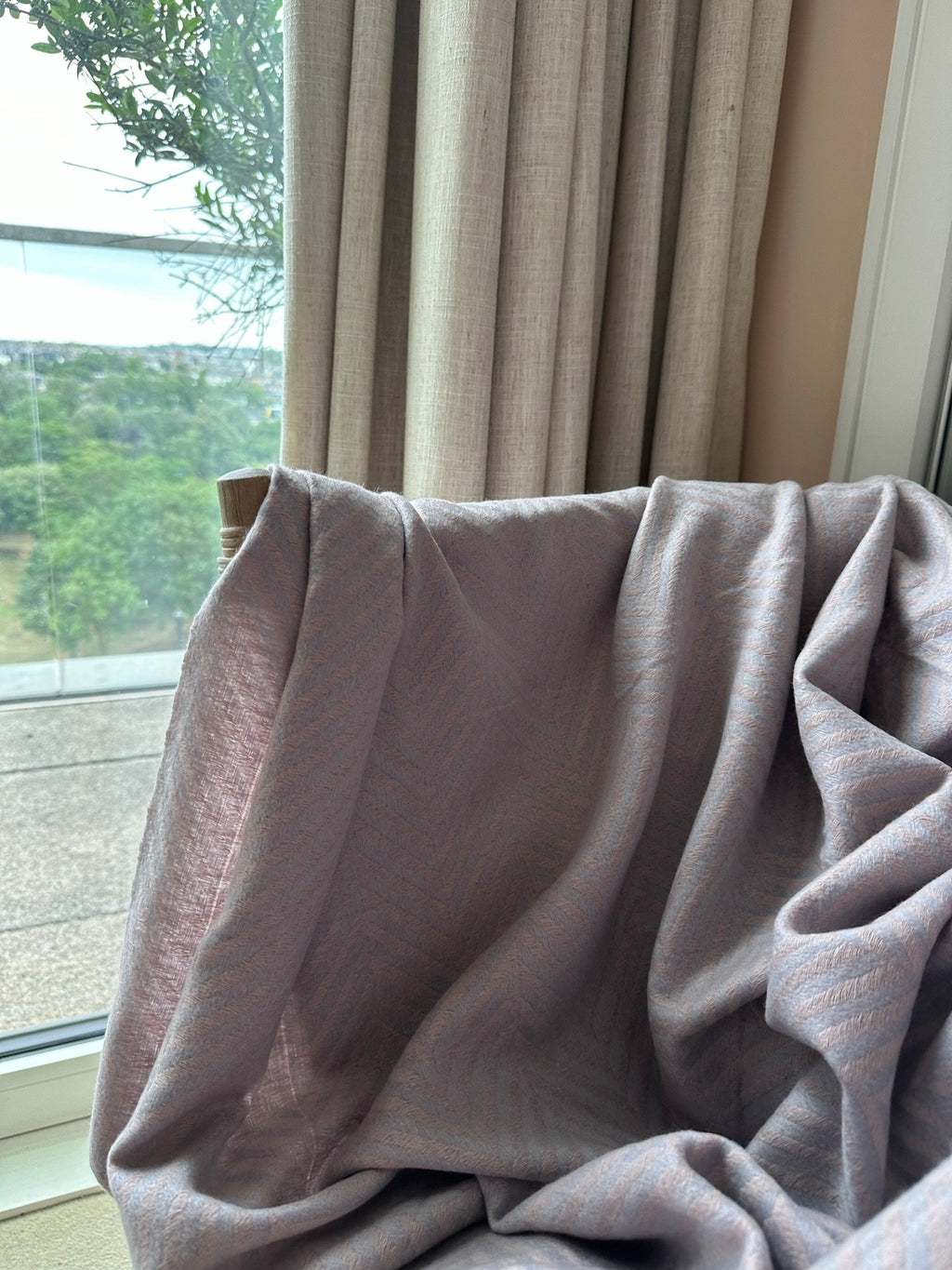pink and blue chevron throw on a chair 